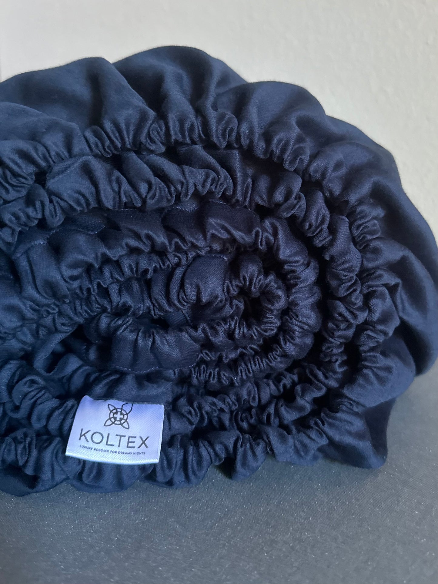 Cooling breathable dark blue fitted sheet close-up