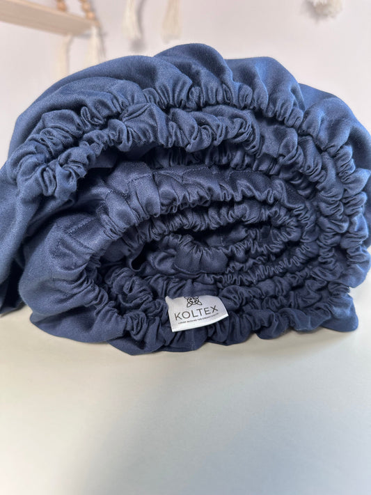 Dark blue sateen fitted sheet with elastic edges