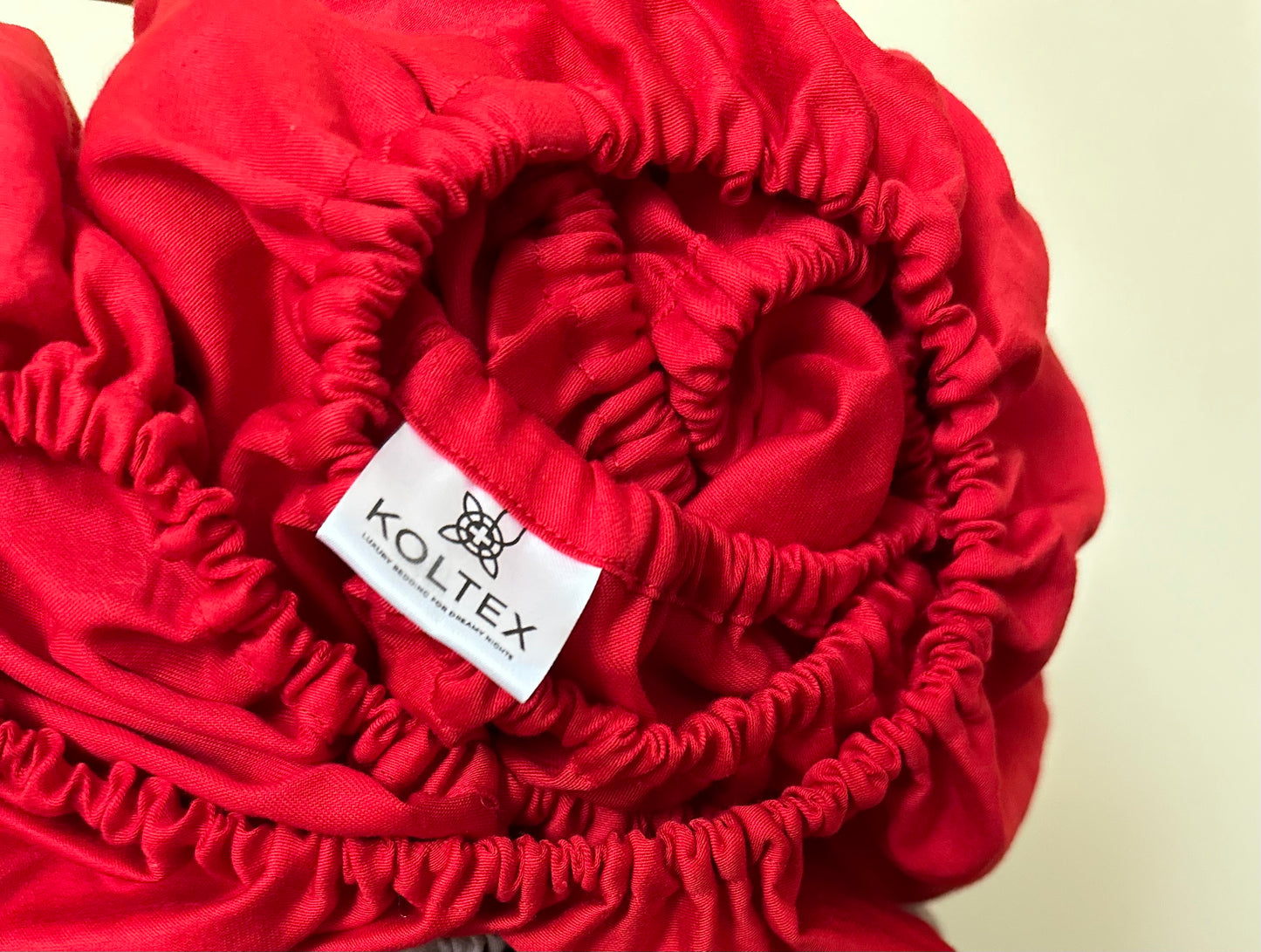 Close-up of elastic band on fitted sateen sheet