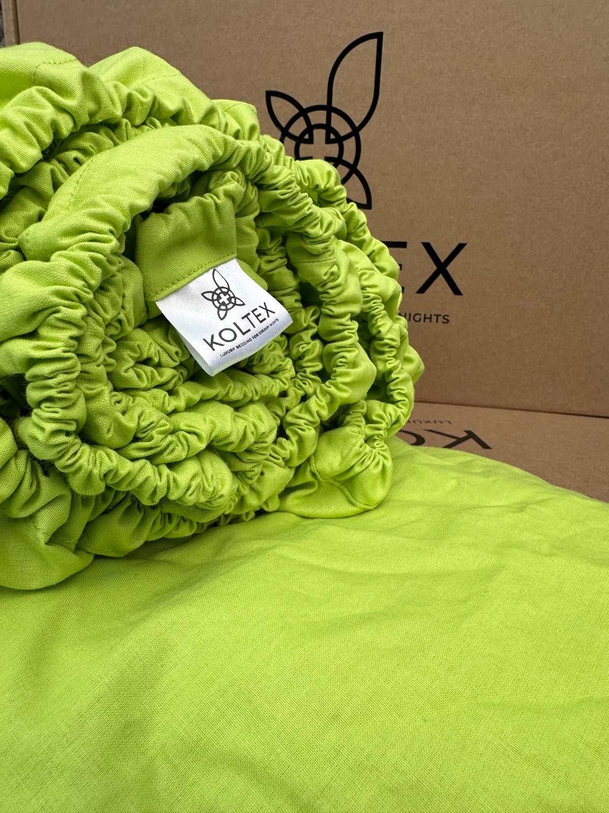 Bright green fitted sheet with deep pockets and elastic