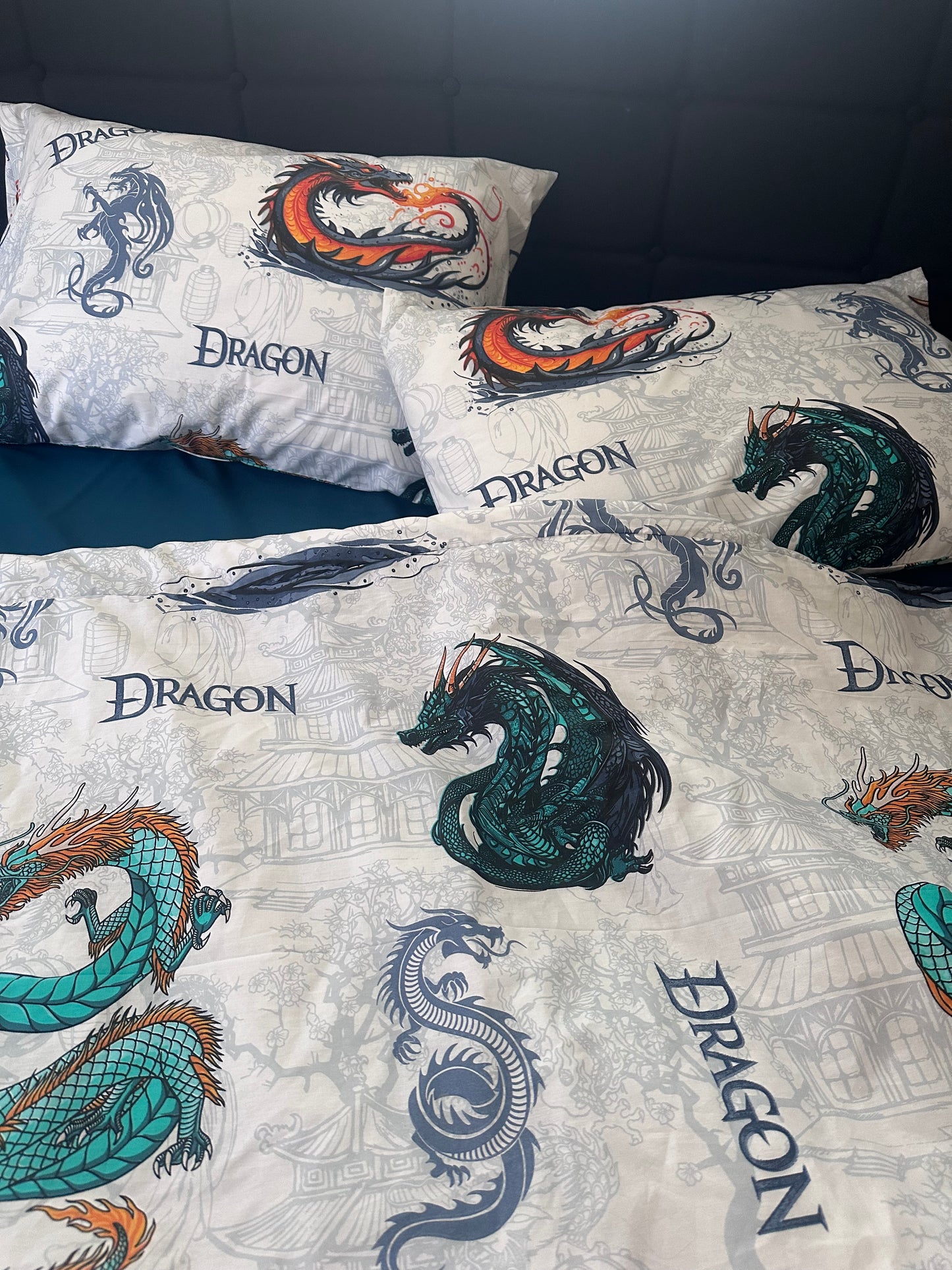 White kids bedding set with colorful dragon print on pillows and duvet