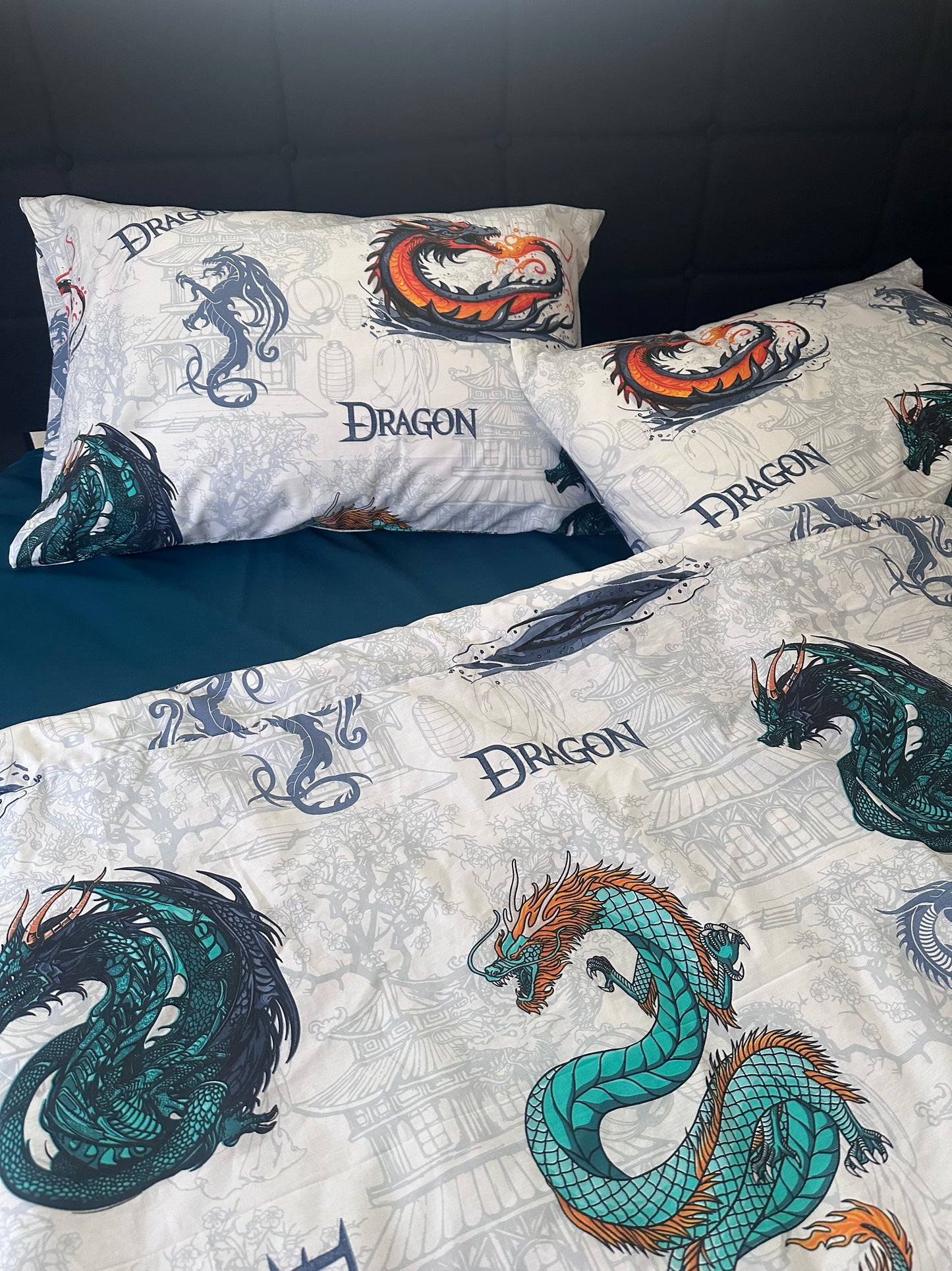 White kids bedding set with colorful dragon print on pillows and duvet