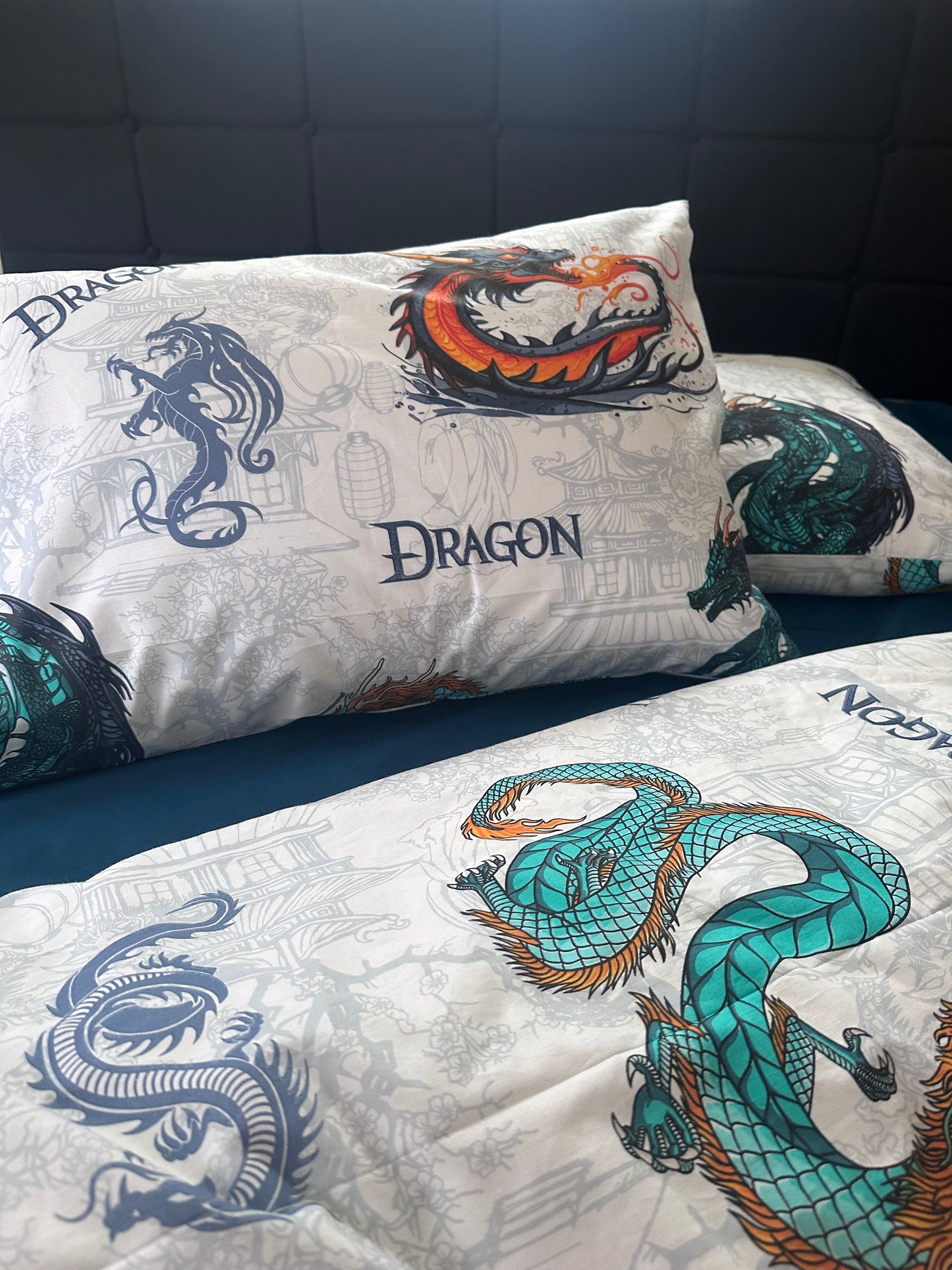 White kids bedding set with colorful dragon print on pillows and duvet