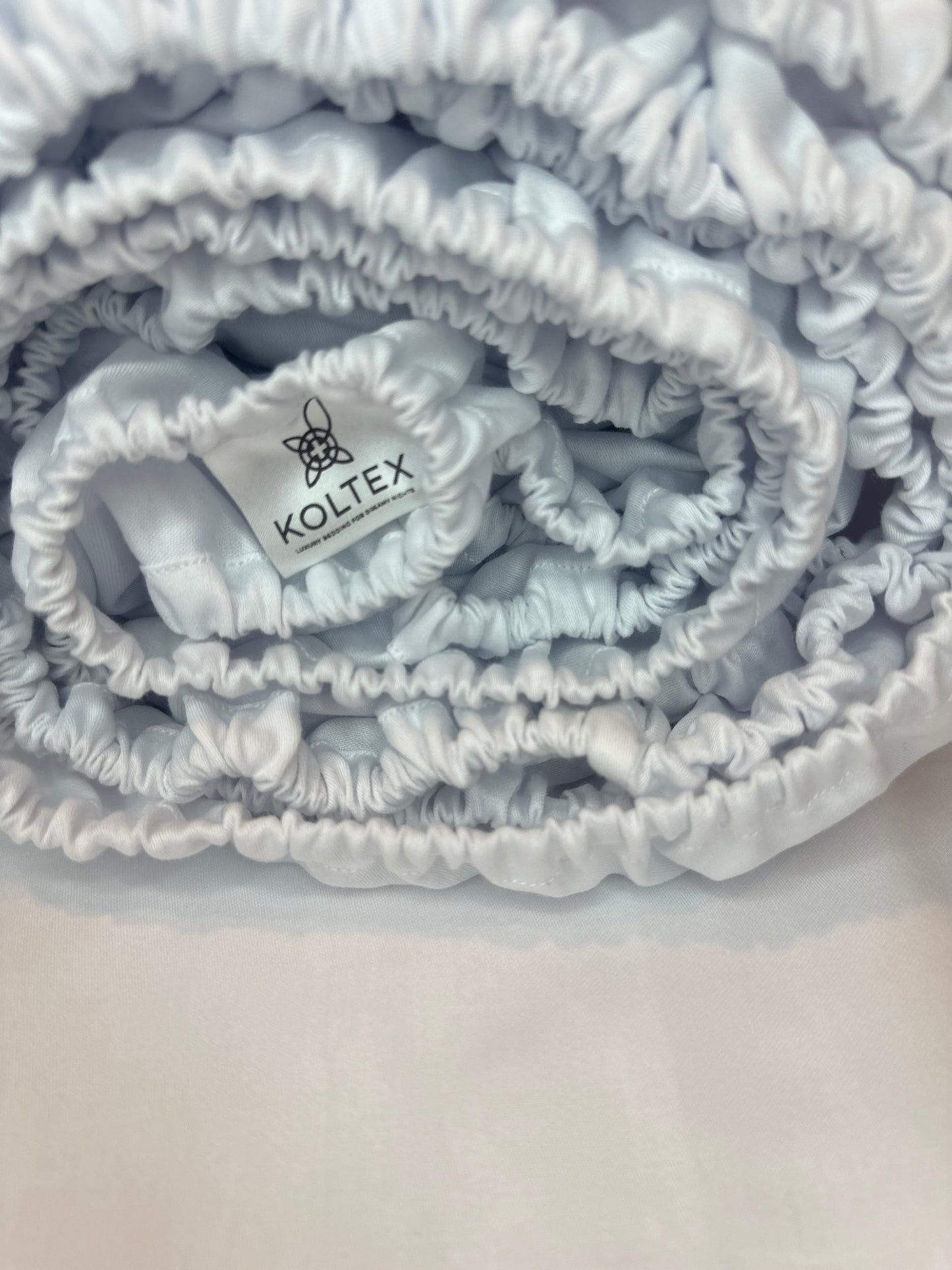 Lux white sateen fitted sheet rolled with elastic edge