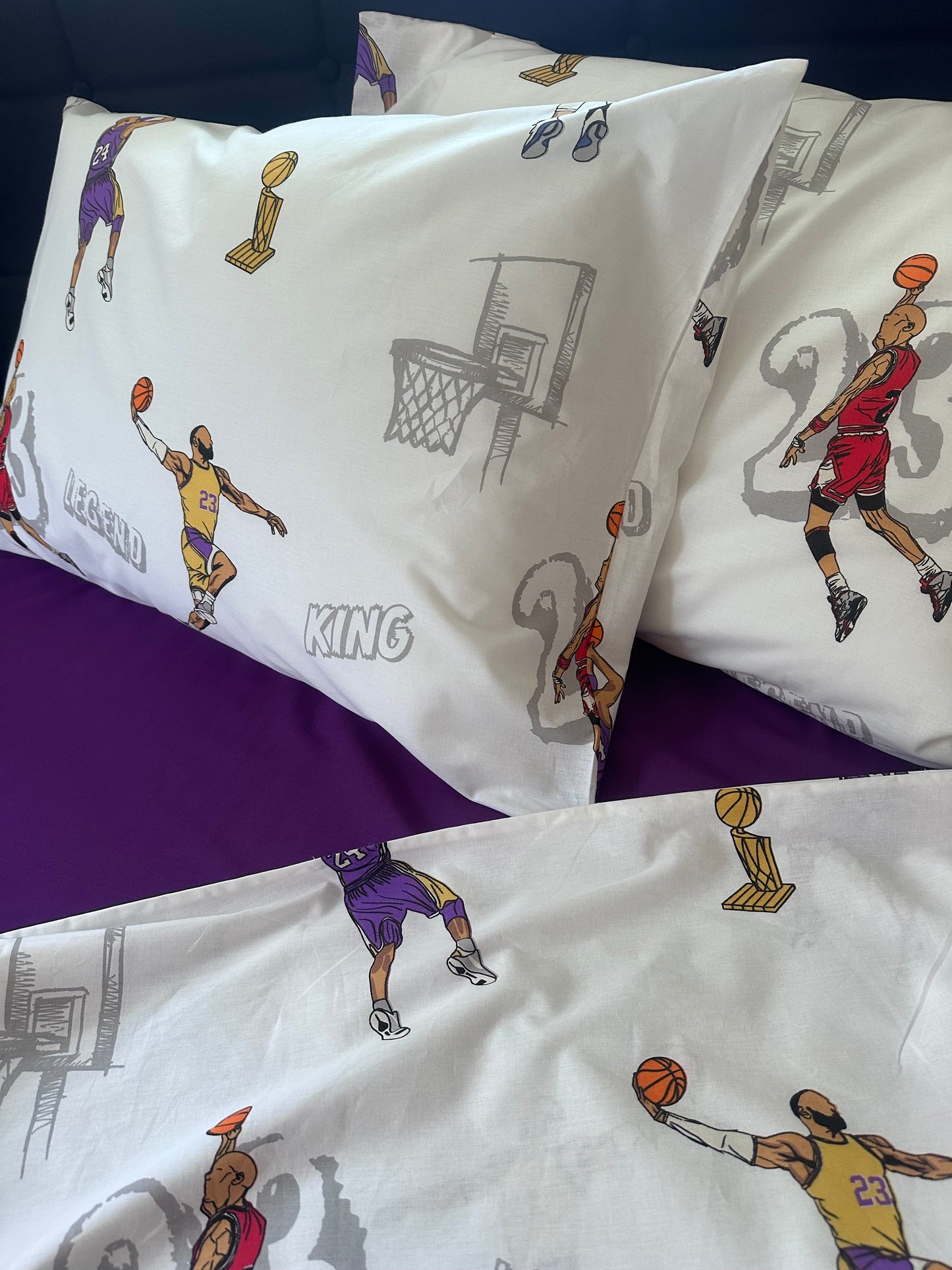 Kids’ bed styled with the basketball-themed pillowcase set (two pillows showing a player dunking and shooting).
