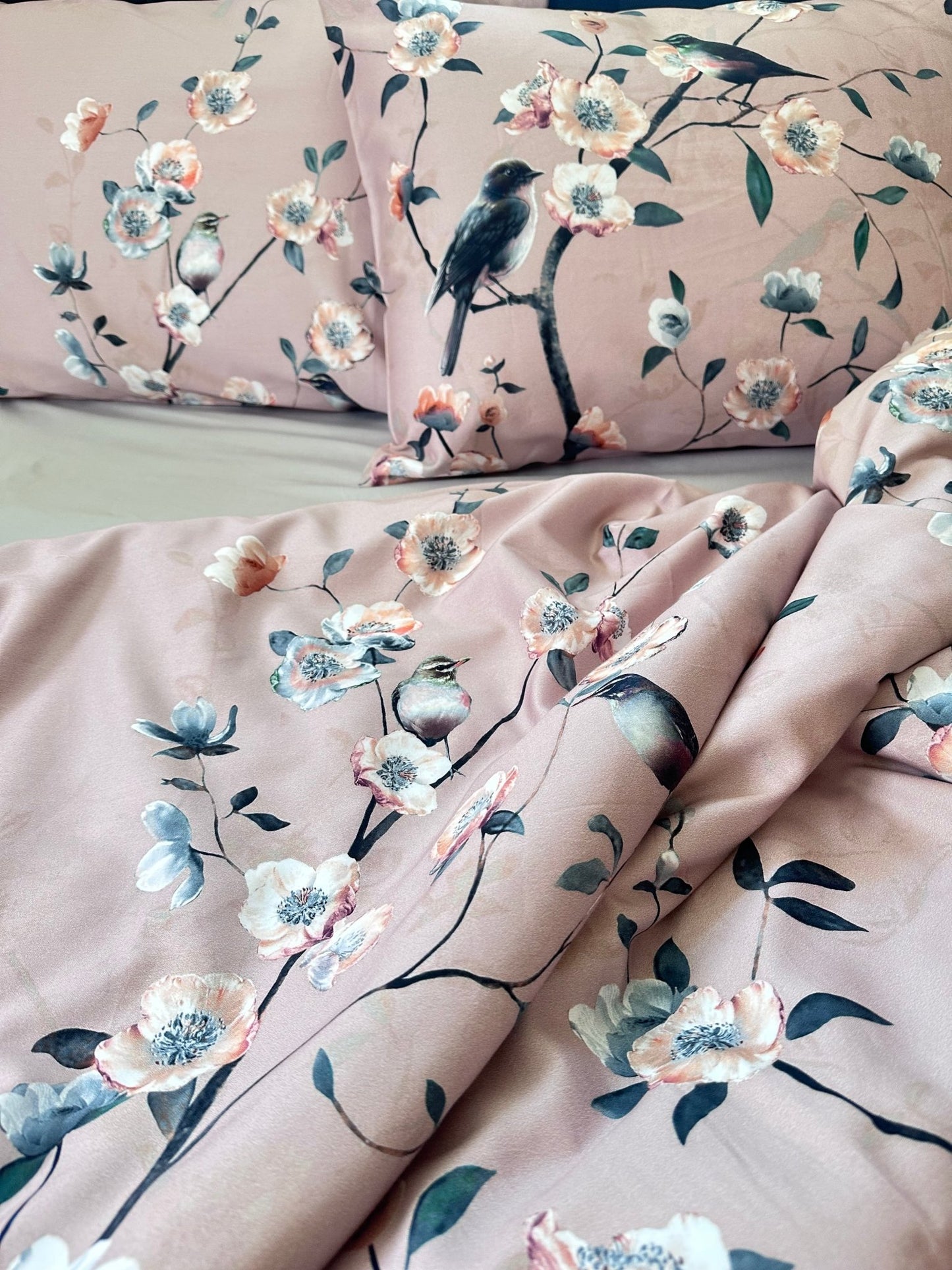 Breathable, eco-friendly floral and bird bedding set in a sunlit bedroom