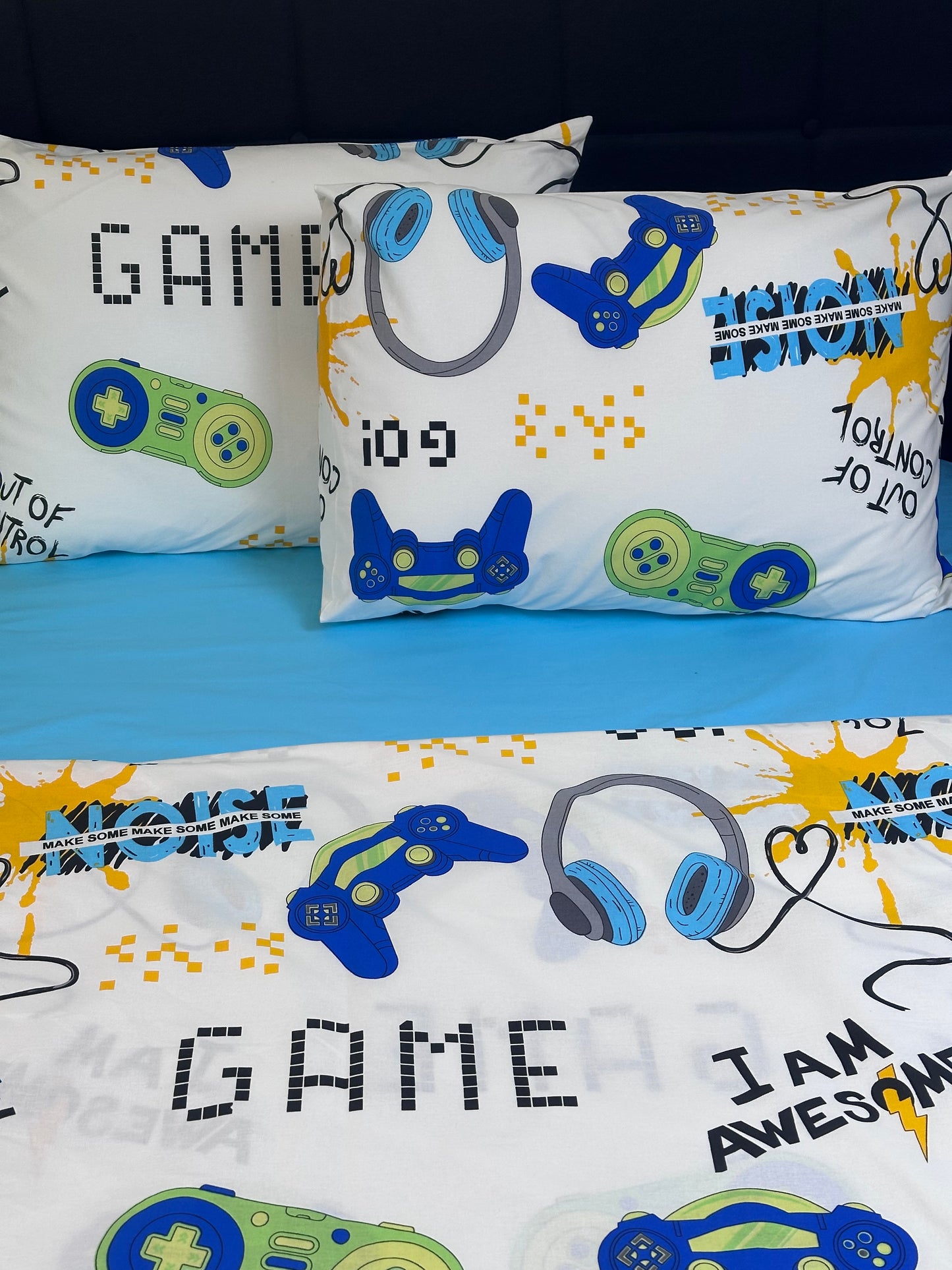 Colorful video game controller and pixel art print bedding set, made from organic cotton for kids’ comfort