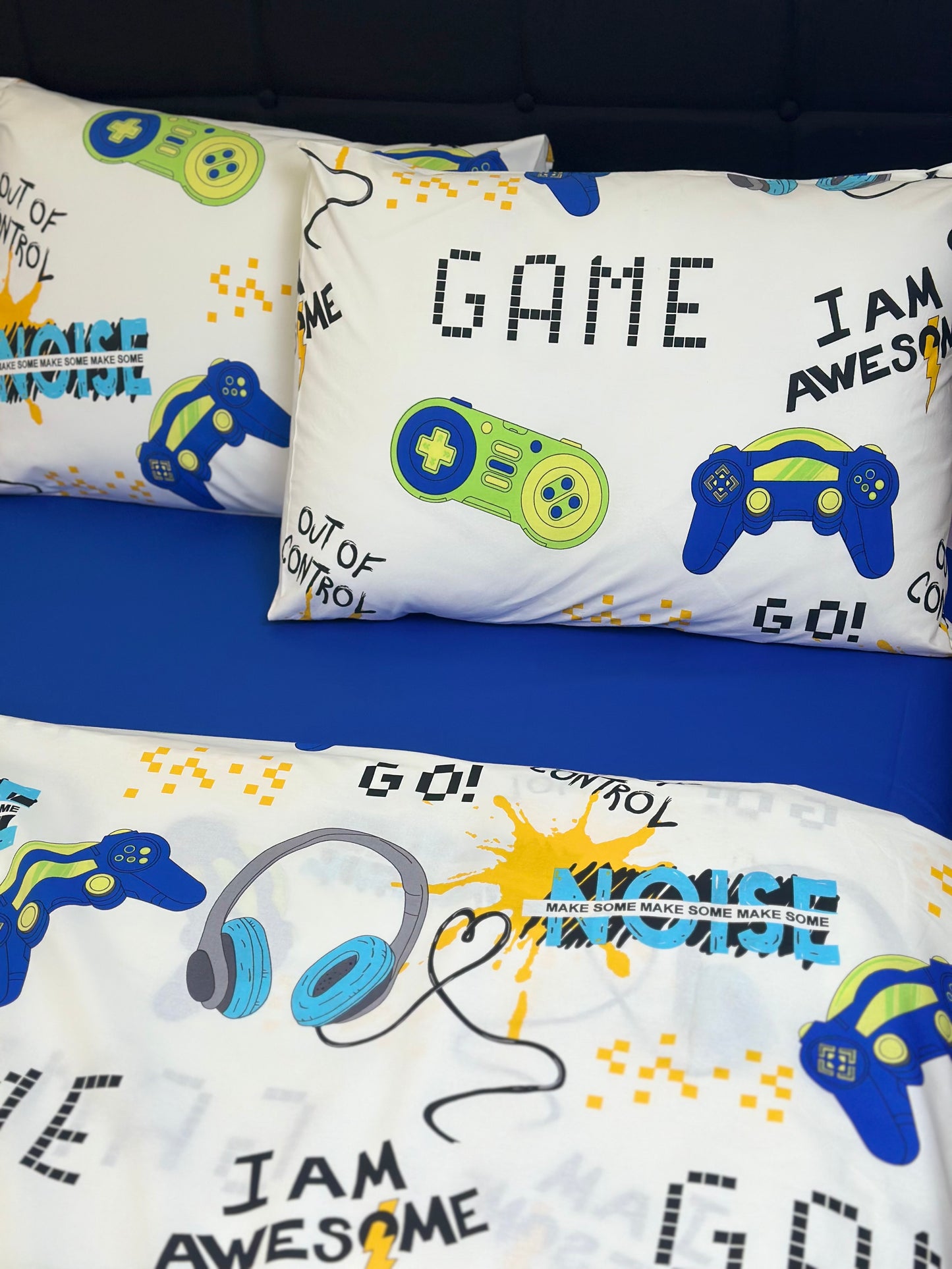 Boys’ room decor with a video game bedding set on the bed, creating a cool gamer bedroom look