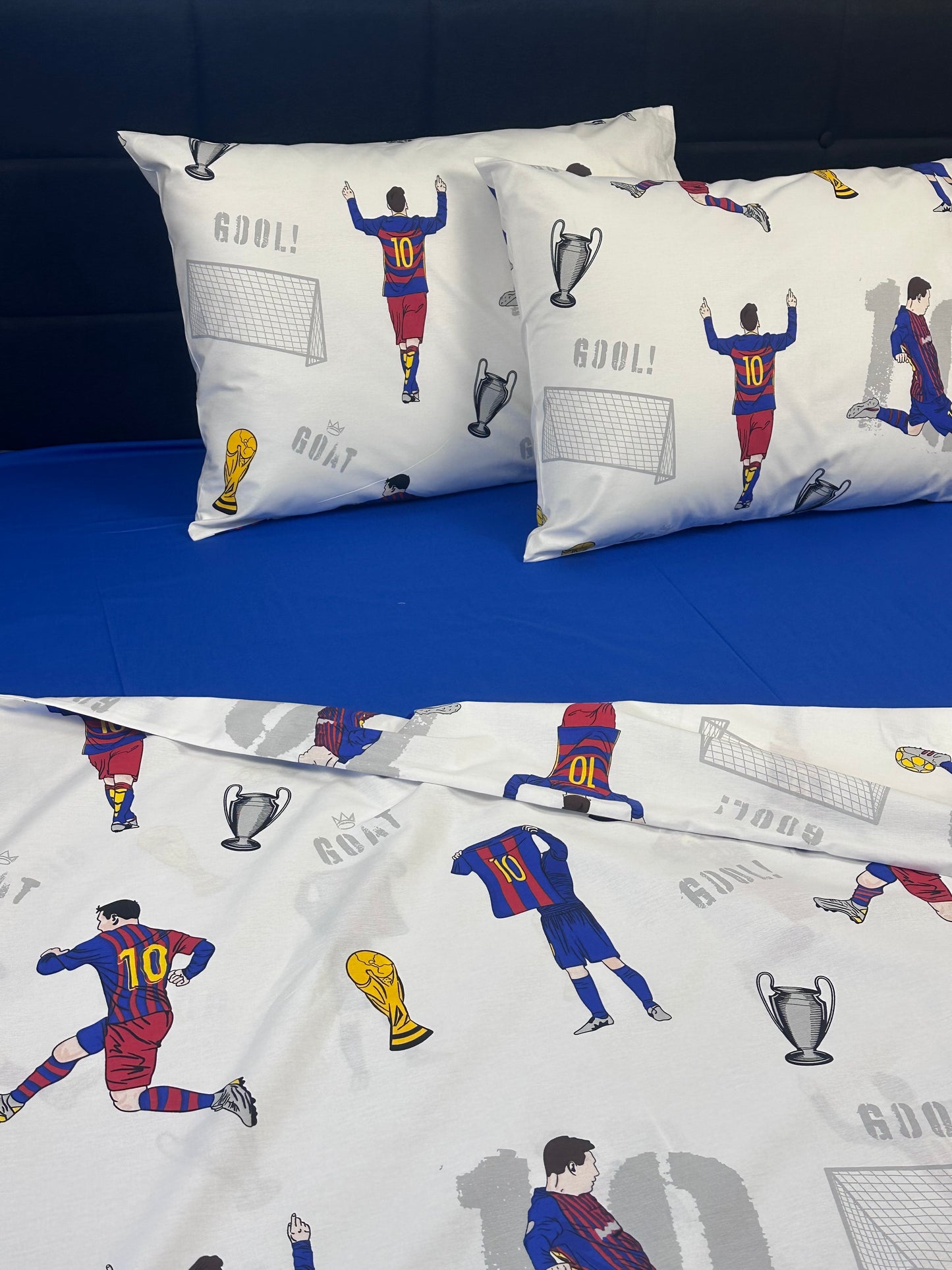 Bedding set with soccer-themed design on a blue background
