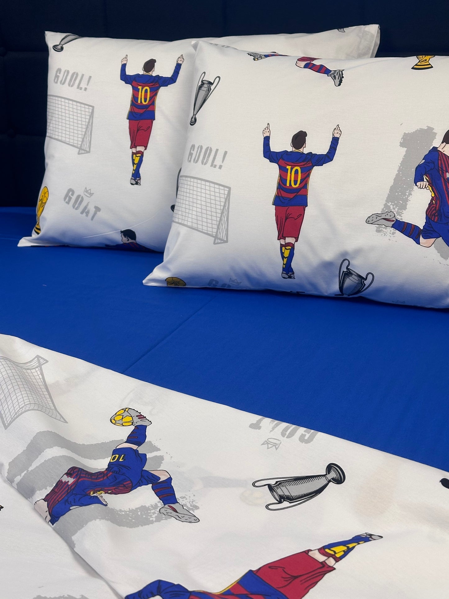 Kids’ room decor featuring a bold soccer theme bedding