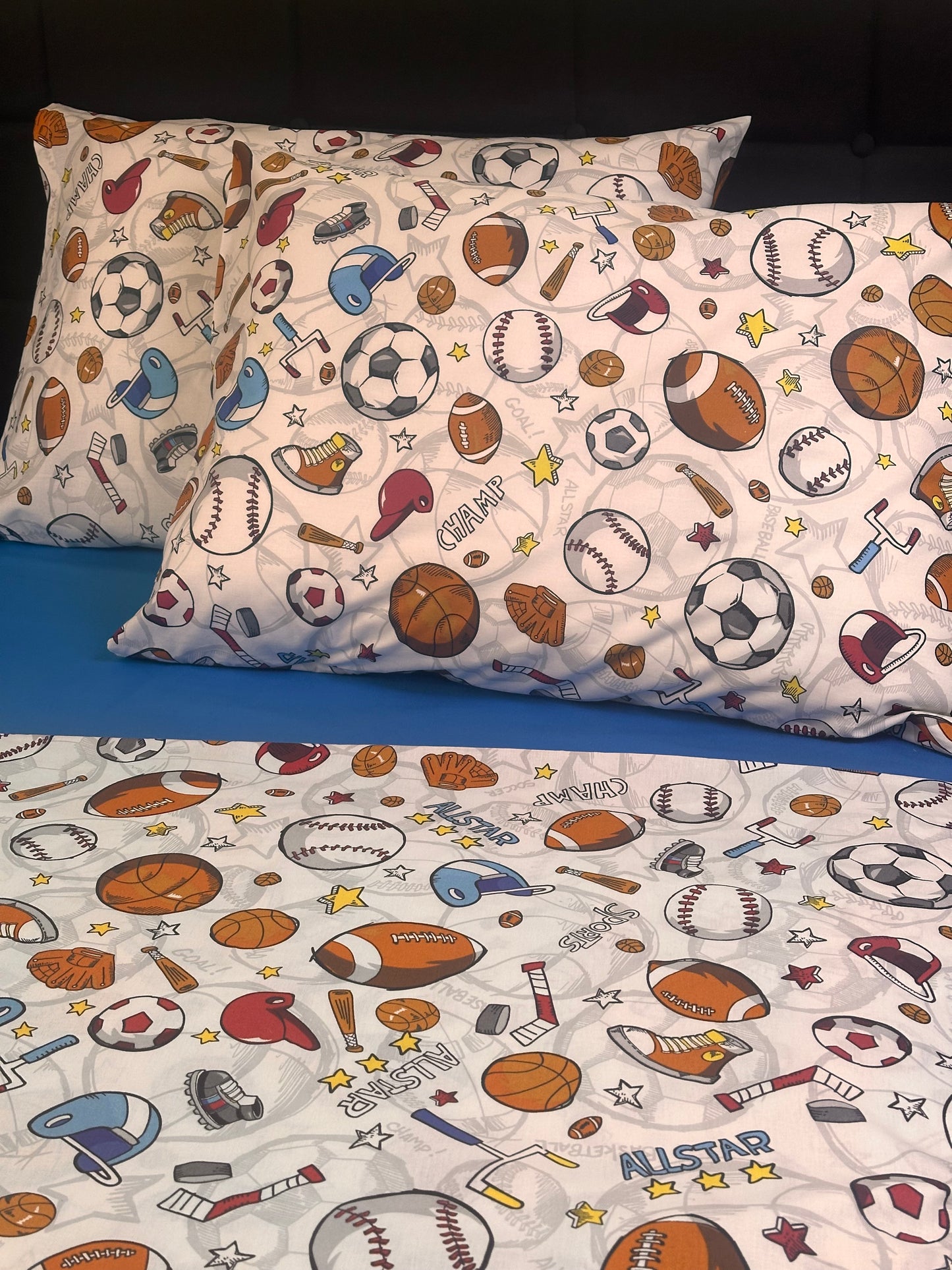 White pillowcases with multicolor sports icons – basketball, soccer, baseball, football
