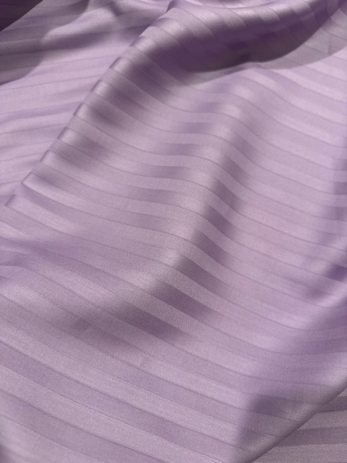 Folded pillowcases with lavender stripes – durable and machine-washable cotton fabric