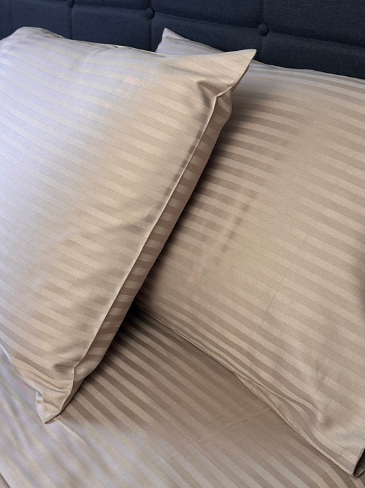 OEKO‑TEX certified mocha brown stripe bedding set on a light bed frame