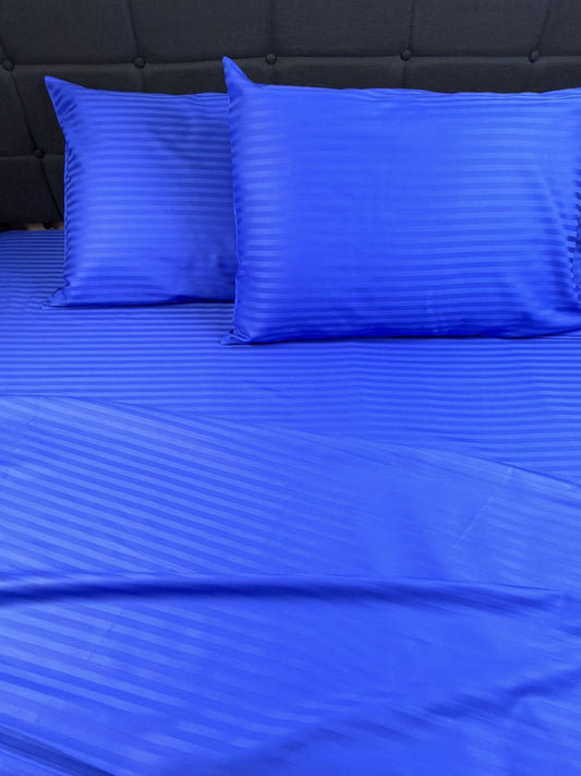 Blue sateen bedding set 100% cotton on bed with soft sheen