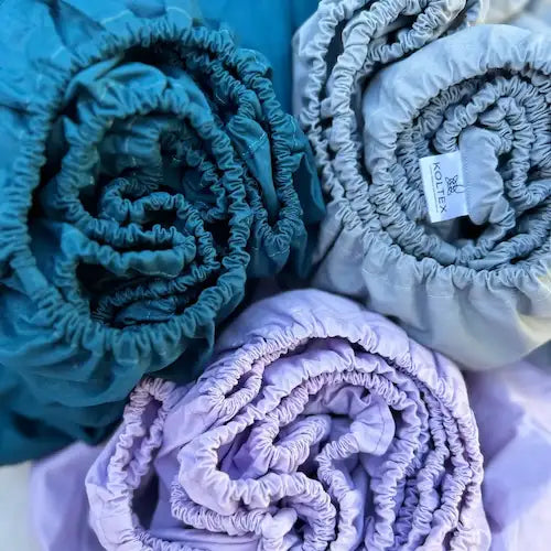 Discover premium cotton fitted sheets — soft, breathable, wrinkle‑resistant, and perfect for sensitive skin. Durable elastic fit and handmade quality for better sleep.
