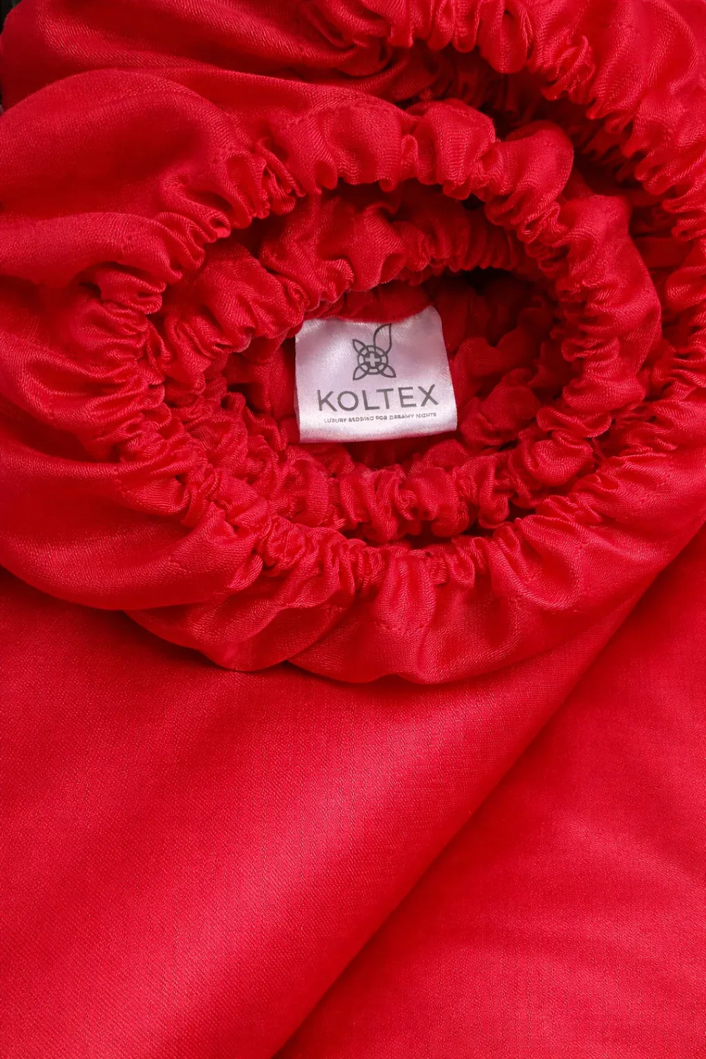 Red Sateen Fitted Sheet made from 100% organic Turkish cotton — silky, breathable and OEKO‑TEX certified.