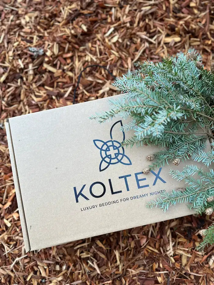 Koltex packaging with a plant on a mulched surface