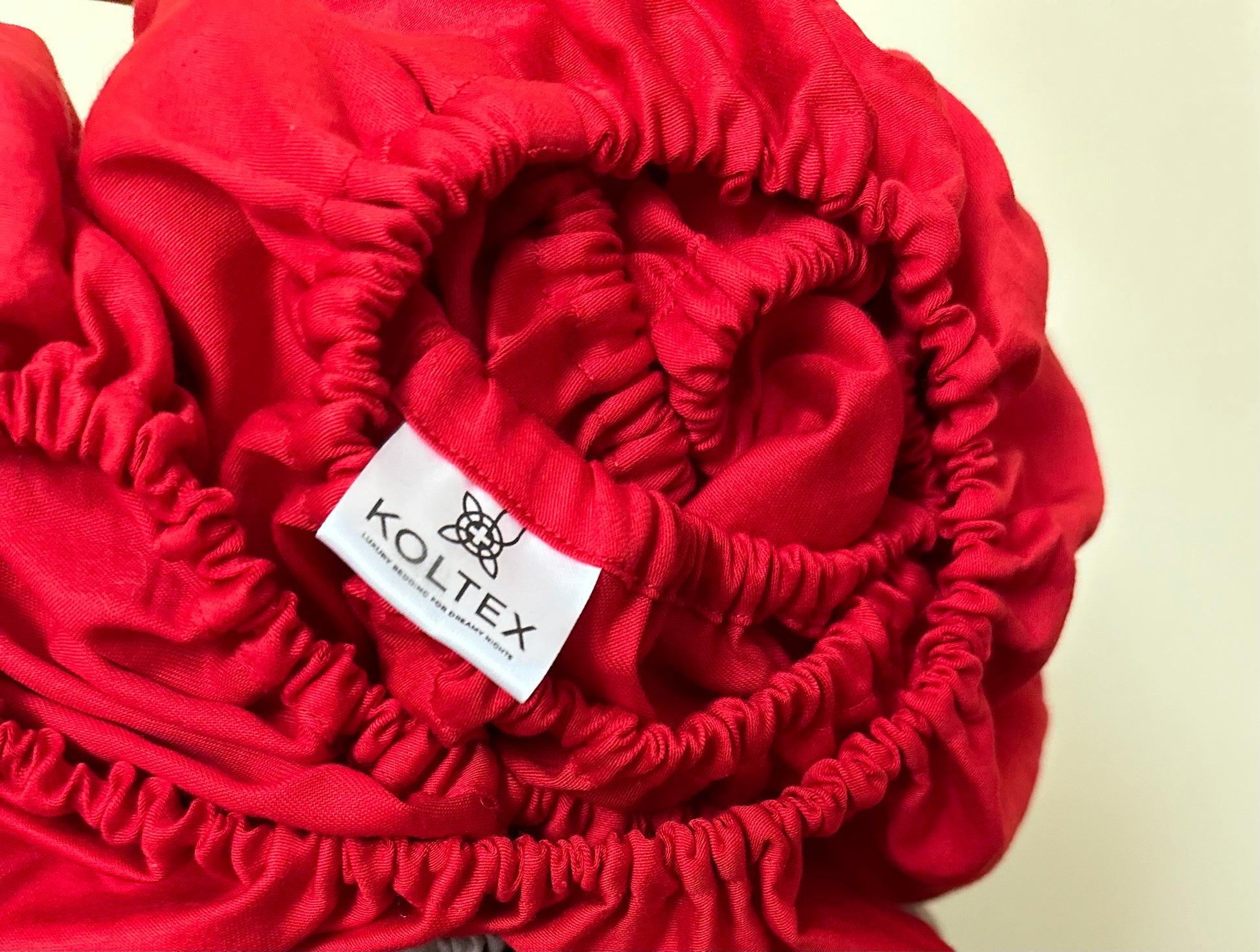 Close-up of elastic band on fitted sateen sheet