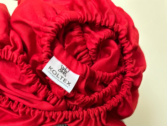 Close-up of elastic band on fitted sateen sheet
