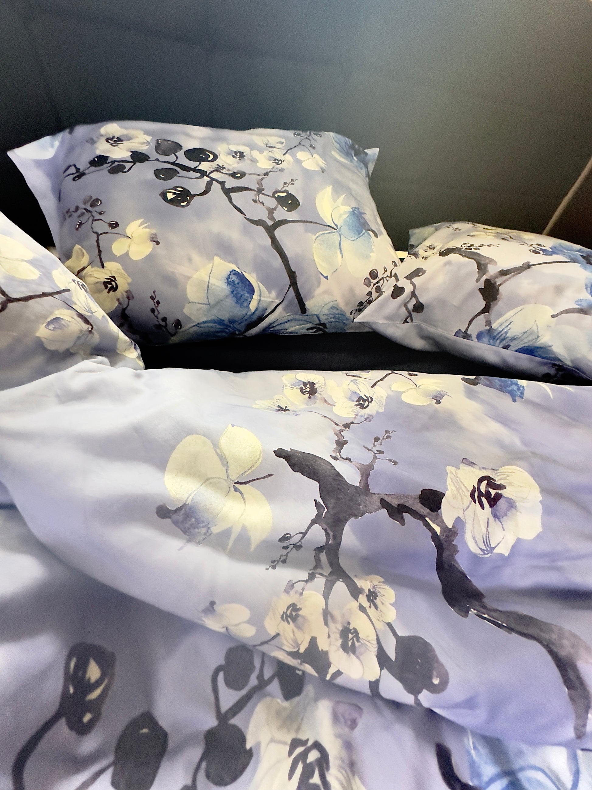 Elegant bedroom with luxurious peacock design cotton sateen pillowcases adding a pop of color.