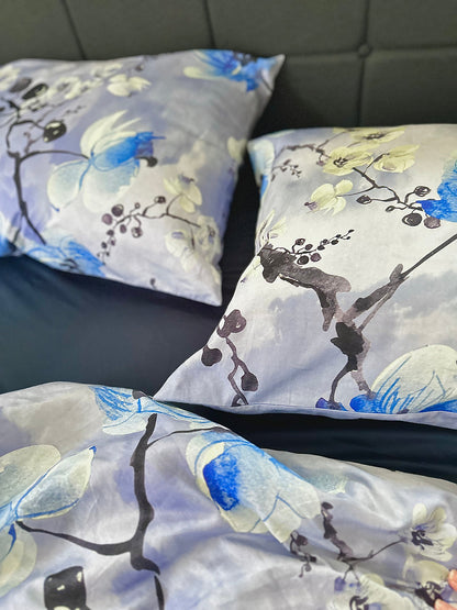 Close-up of silky sateen bedding with colorful floral patterns