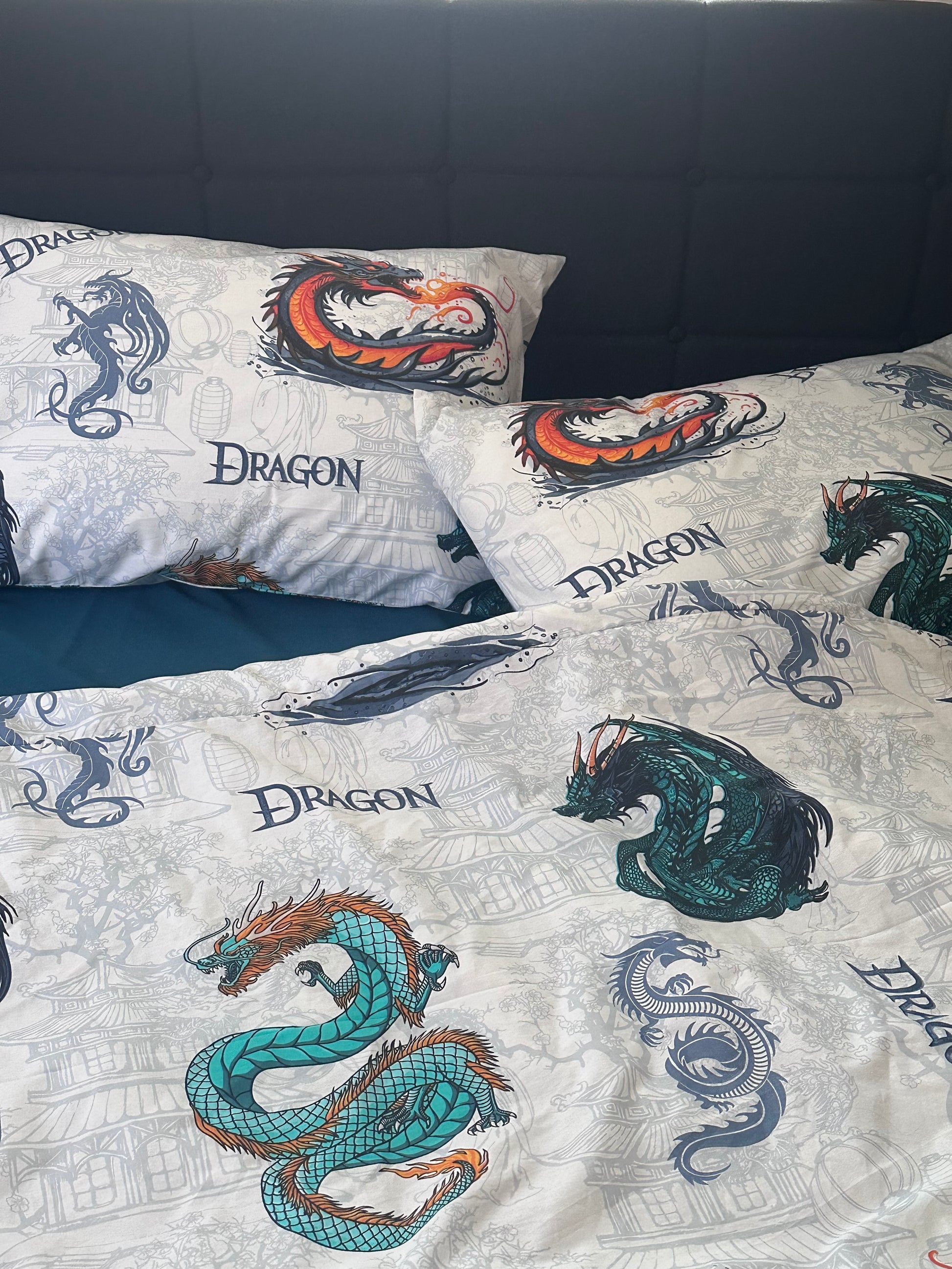 White kids bedding set with colorful dragon print on pillows and duvet