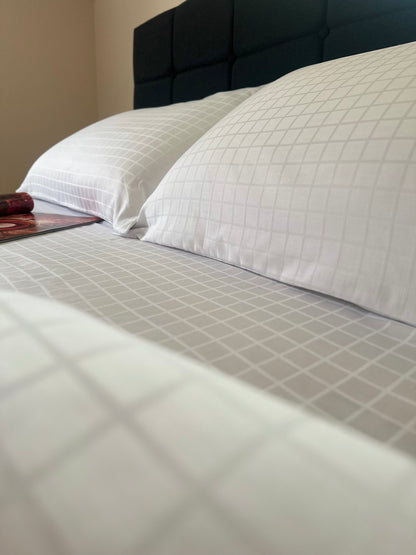 Close-up of smooth and shiny sateen jacquard bed sheet