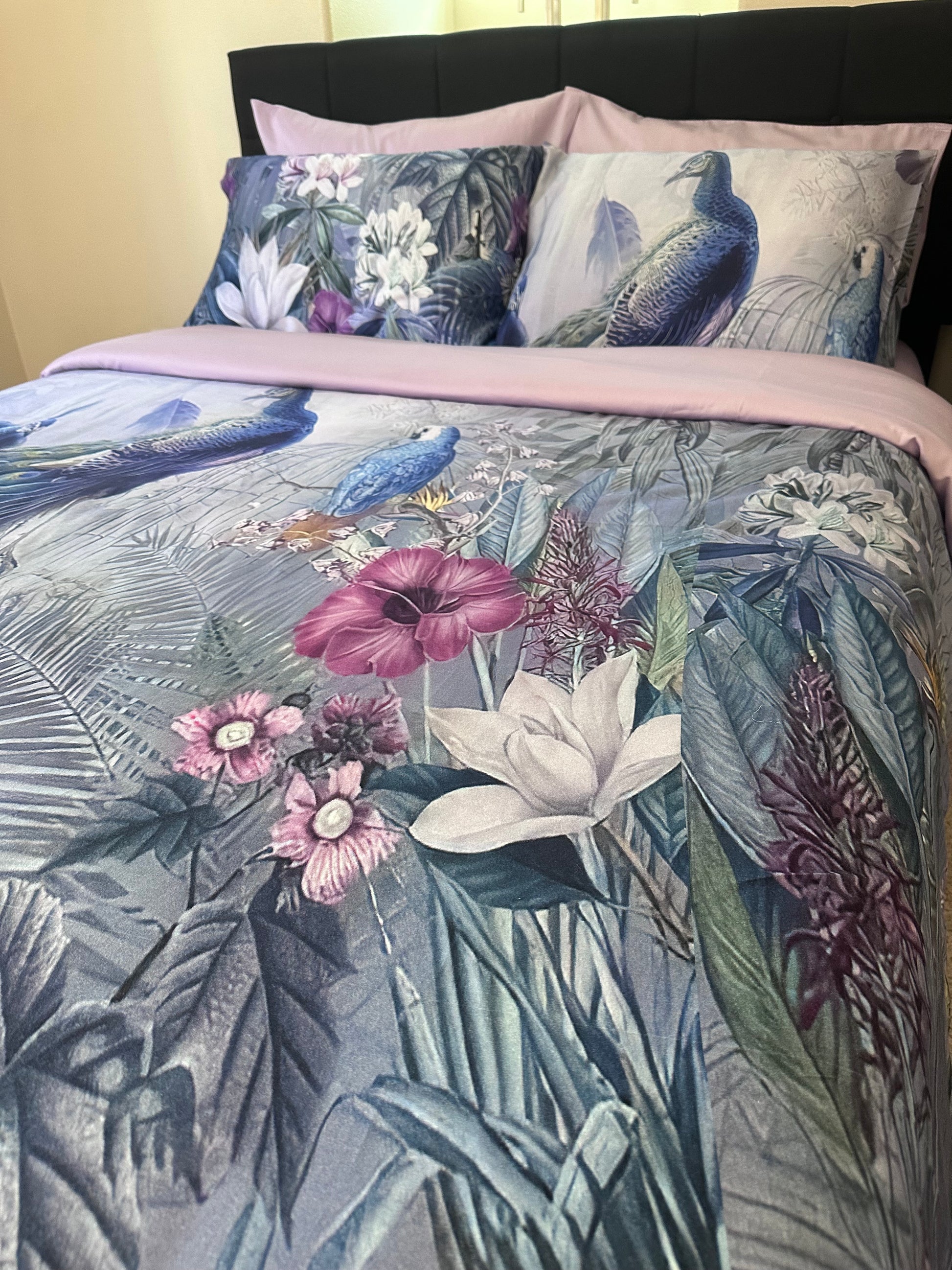 Close-up of silky floral patterned bedding fabric