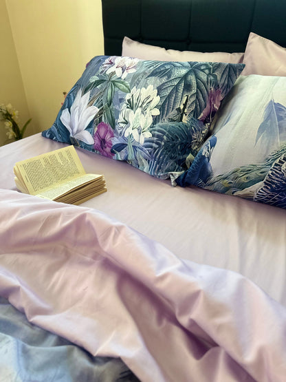 Book on a bed with floral pillows