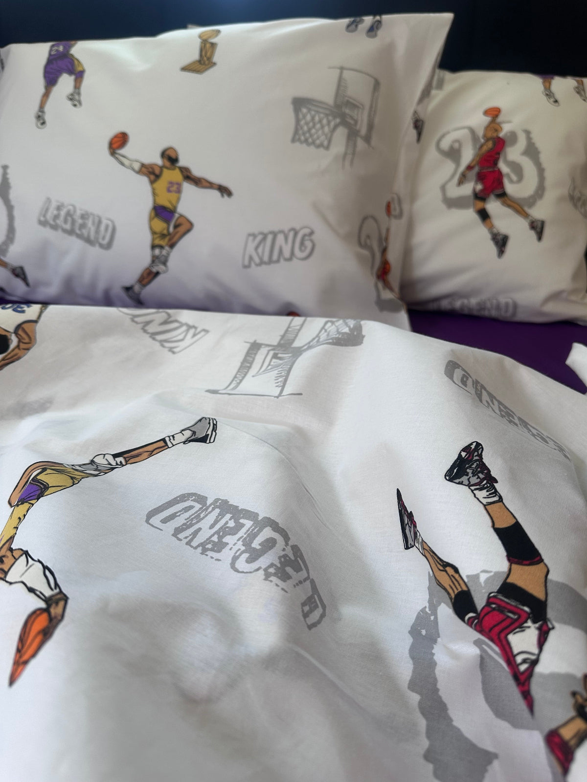 Close-up of fabric with basketball sports-themed designs on a white background