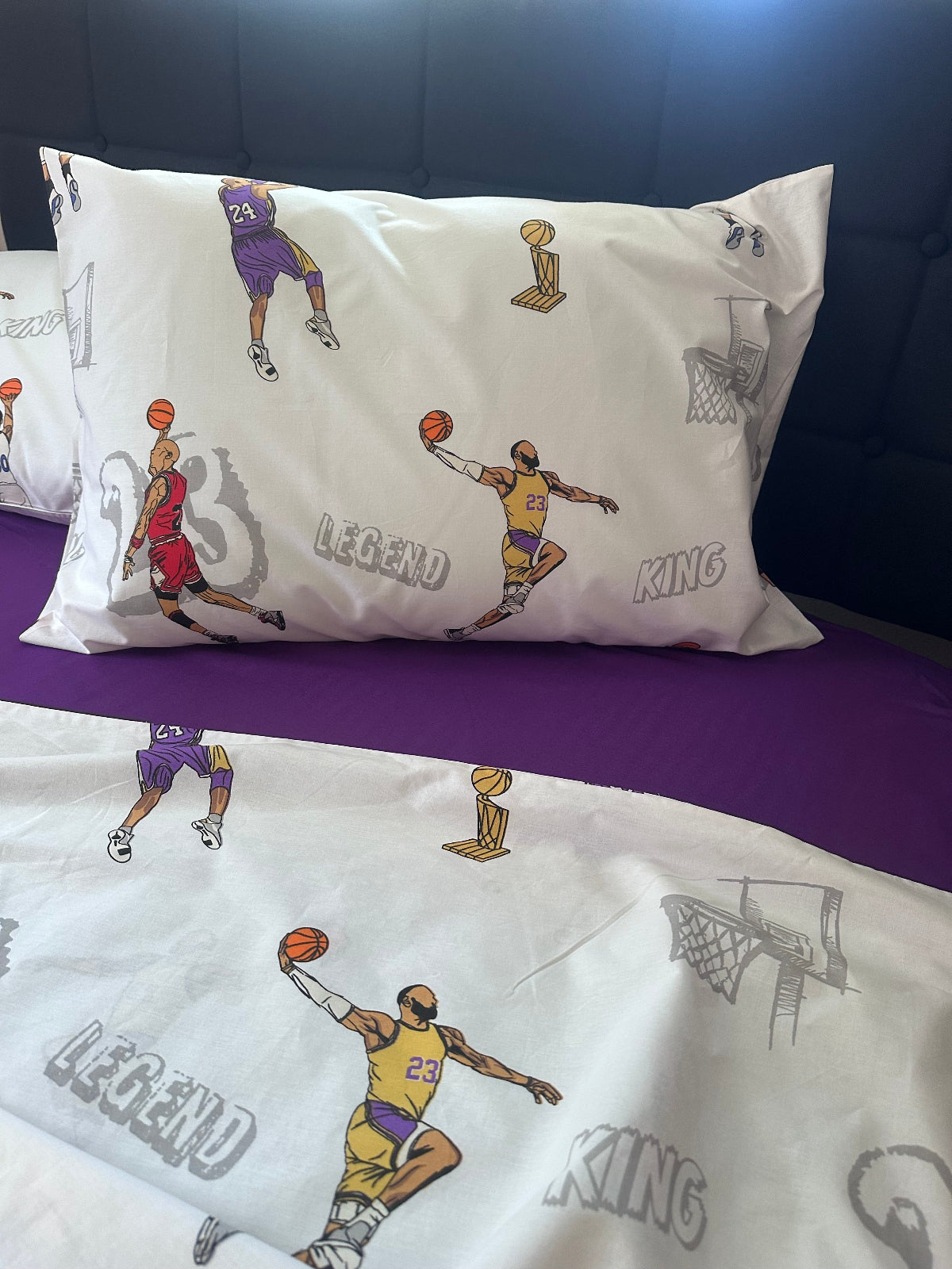 Two pillows with basketball player illustrations and 'Legend' text on a purple background