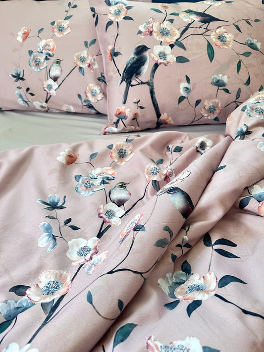 Breathable, eco-friendly floral and bird bedding set in a sunlit bedroom