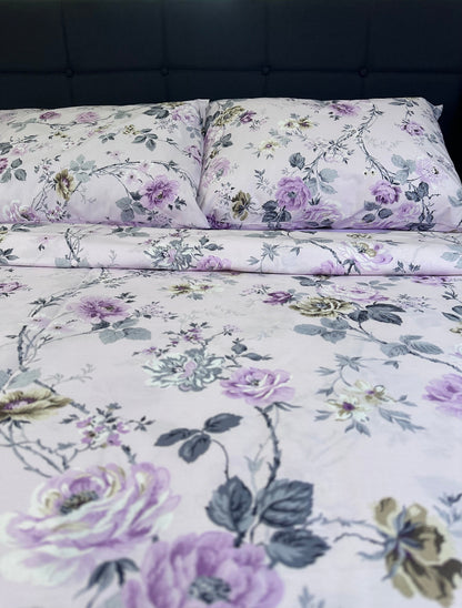 Lavender floral cotton bedding set with French country rose pattern on bed