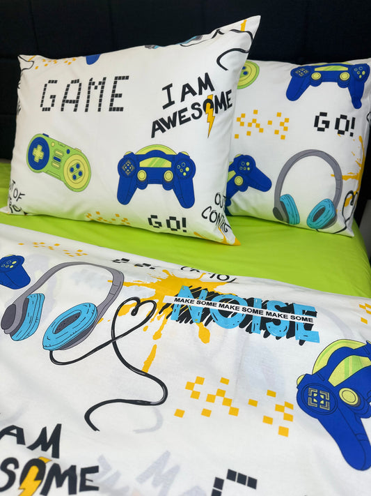 Close-up of the gamer-themed duvet cover and pillowcases featuring colorful video game controller graphics