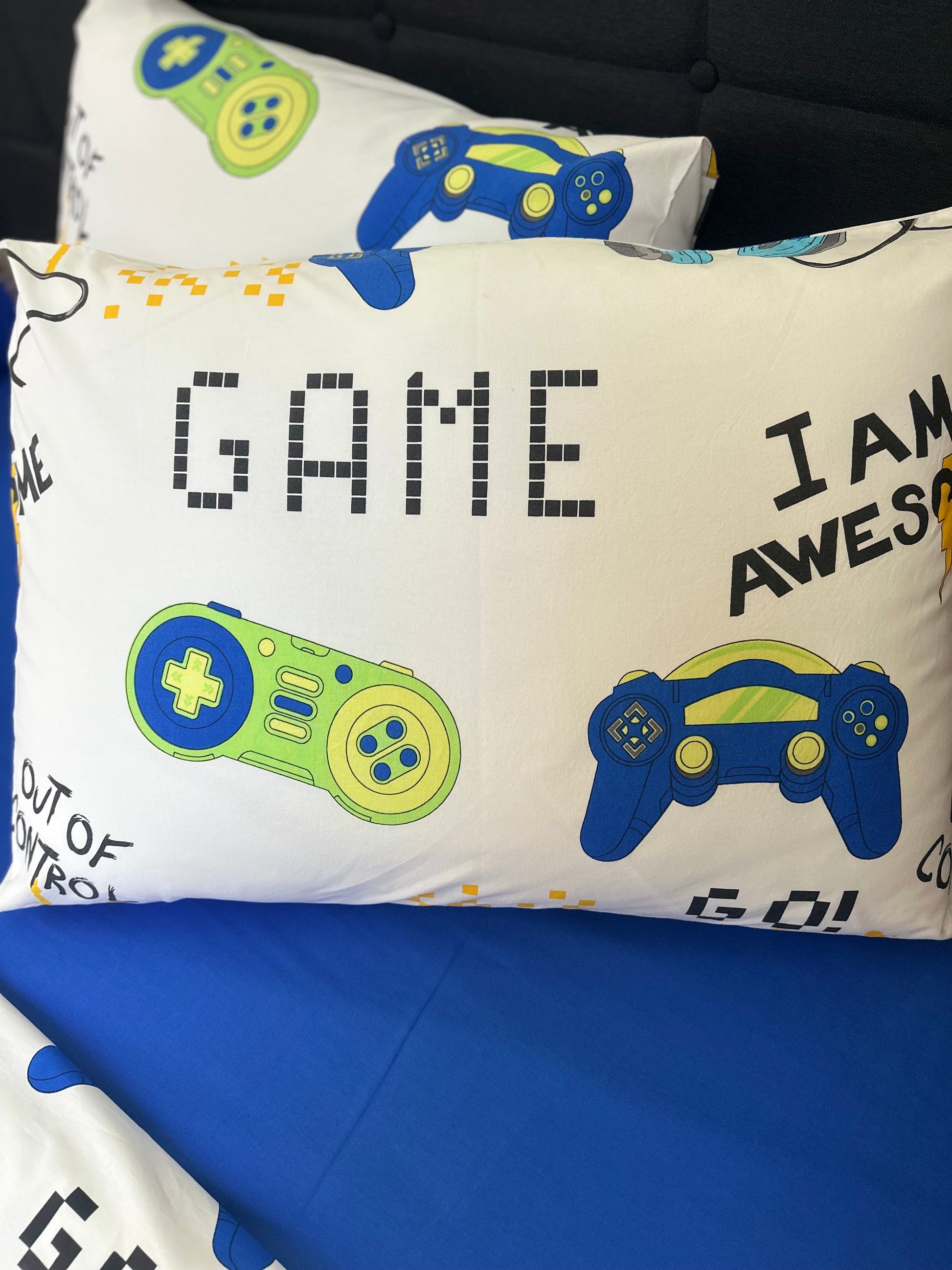 Fun cotton video game pillow covers for teens and kids, placed on pillows in a themed bedroom