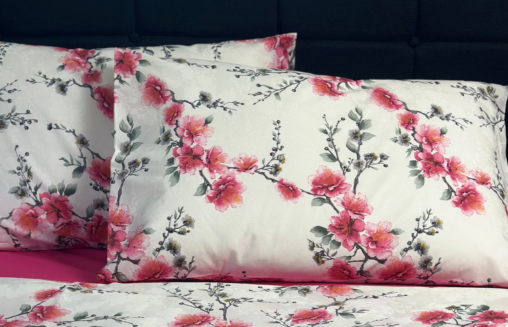 Close-up of pink sakura floral print on Turkish cotton pillow