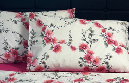 Close-up of pink sakura floral print on Turkish cotton pillow