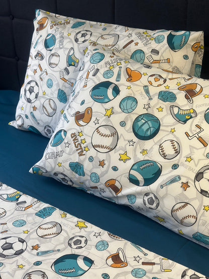 Pillowcases with sports-themed pattern on a bed