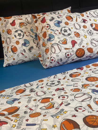 Sports themed pillowcases and bedding set with baseball, soccer, and basketball print on white background