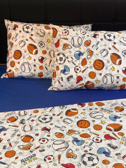 Fun boys bedroom bedding set and pillowcases with football, basketball, and hockey prints