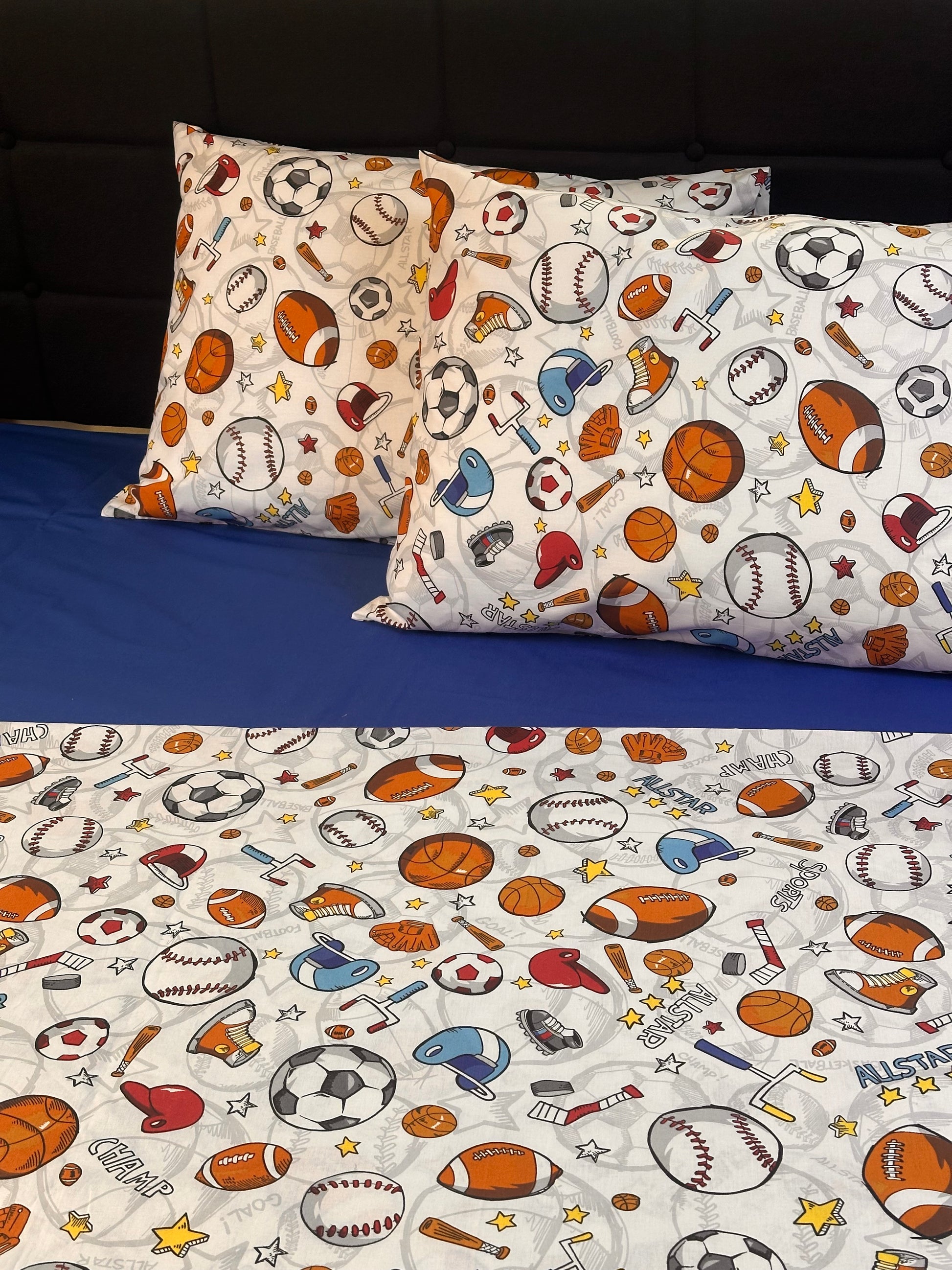 Playful sports pattern pillowcases with baseball bats, helmets, and soccer balls
