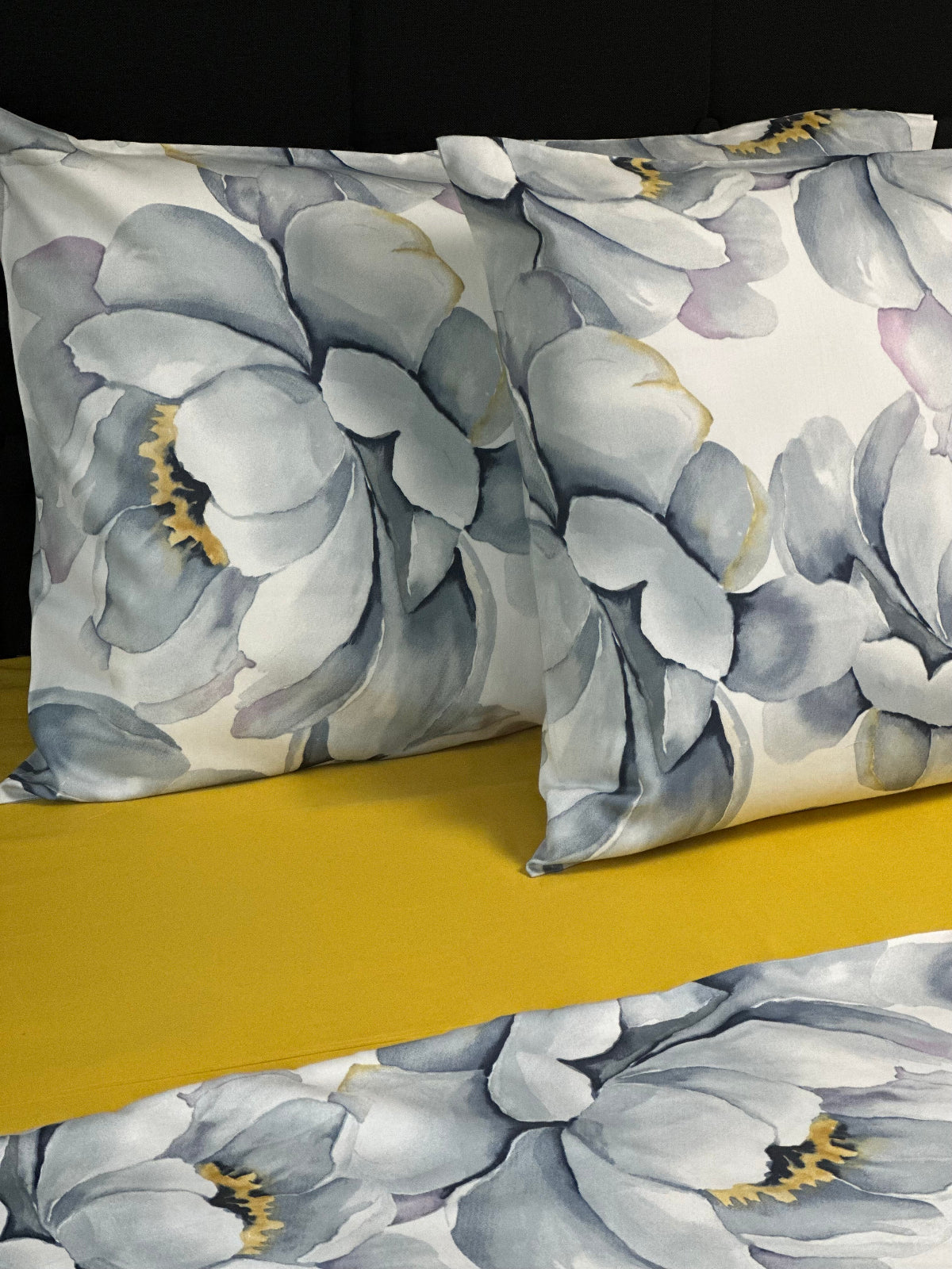 Minimalist watercolor flower bedding set featuring large gray peonies and warm yellow centers.
