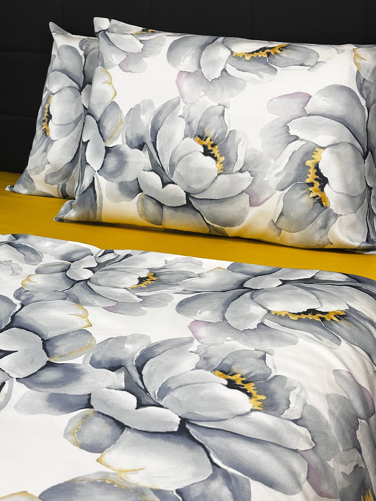 Beautiful gray peony floral bedding set displayed with a mustard-colored fitted sheet.