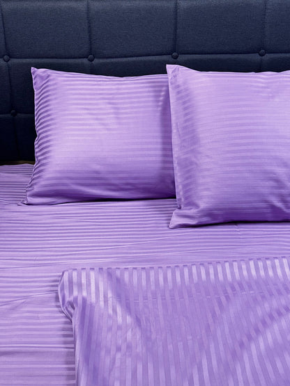 Close‑up of lavender stripe cotton sateen fabric — smooth, silky and hypoallergenic.