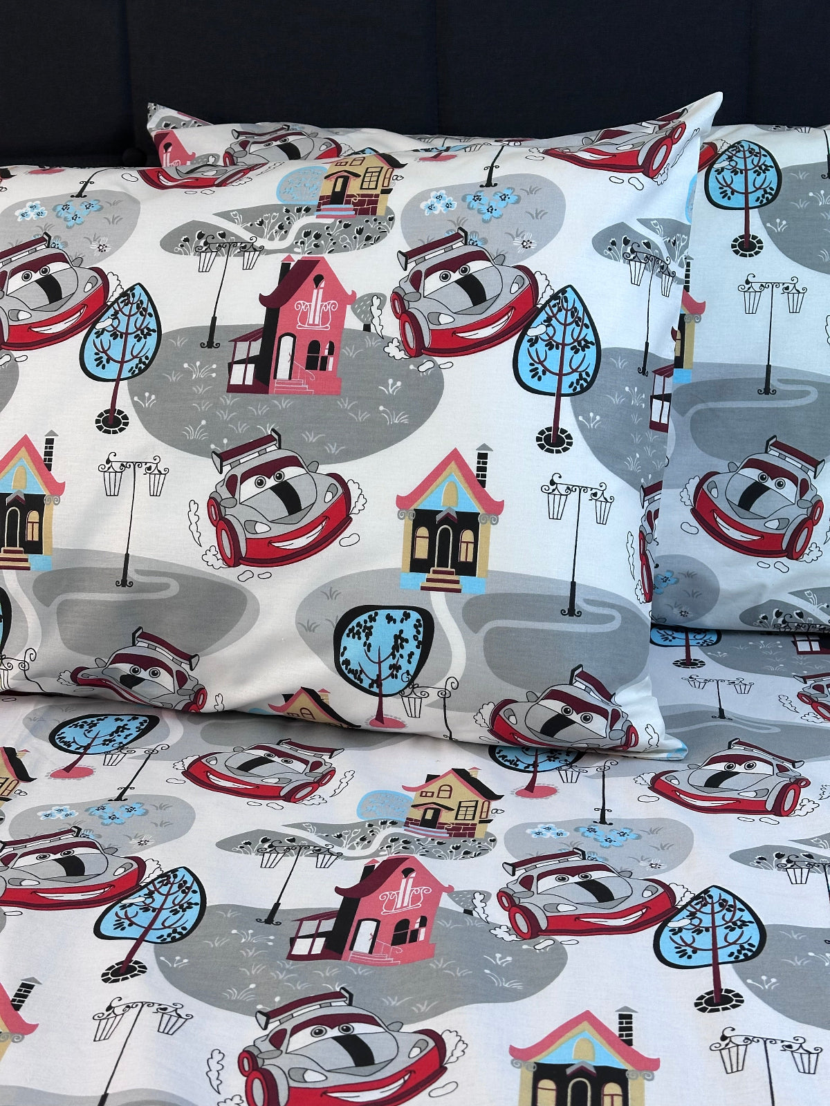 Soft children’s pillowcase with vibrant car pattern — premium organic cotton for everyday comfort
