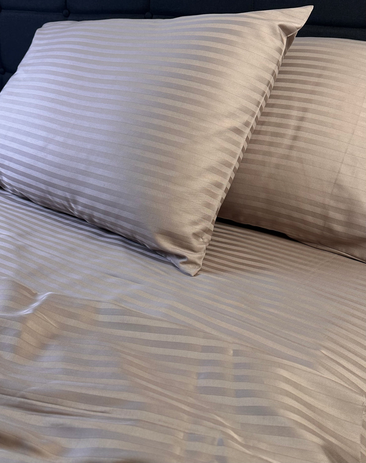 Hypoallergenic mocha stripe bedding set displayed in a modern bedroom