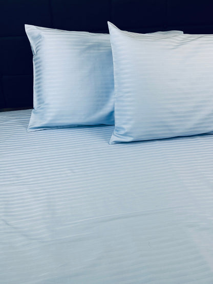 Premium cotton sateen bedding in sky‑blue stripe pattern