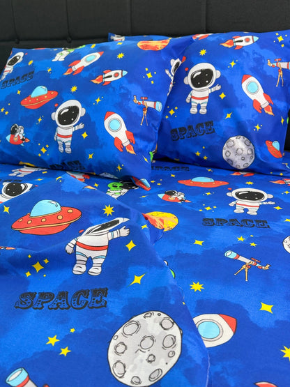 Space-themed bed sheet set with astronauts, rockets, and planets on a blue background.