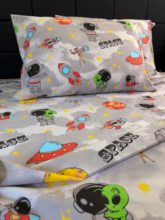 Space‑themed Kids Cosmic Bedding Set with planets, stars and astronauts — organic cotton