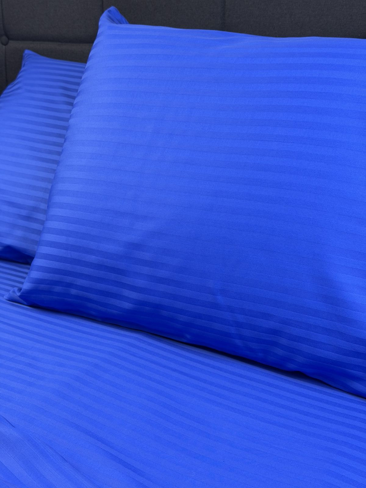 Blue sateen pillowcase made from 100% cotton with soft silky sheen